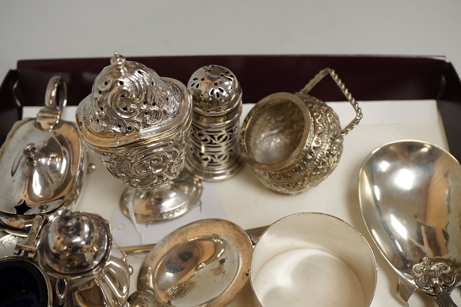 A collection of silver to inlcude a George V cigarette case, Victorian and later cruet items, assorted napkin rings etc. various, weighable silver approx. 18.4ozt